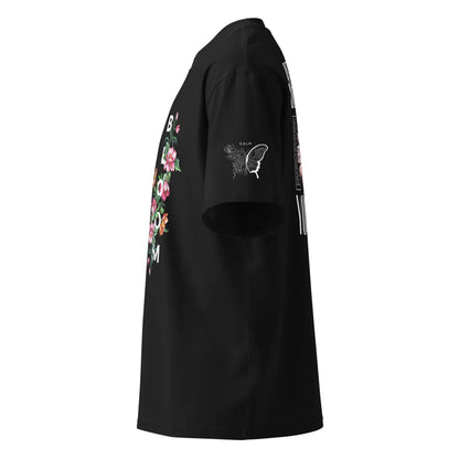 Side view of a black unisex oversized T-shirt with floral and butterfly print on the chest and sleeve